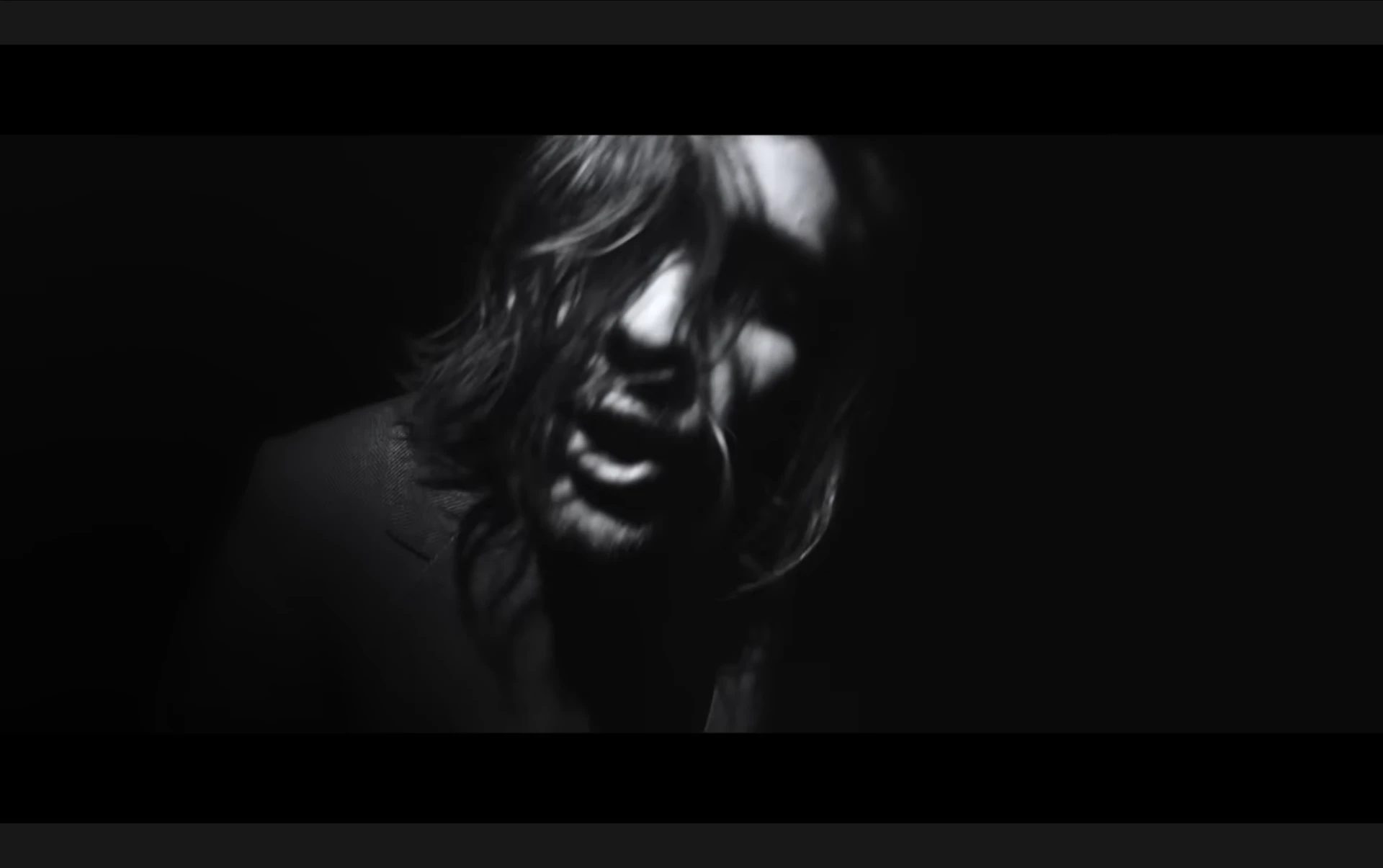 Black and white close-up from a music video